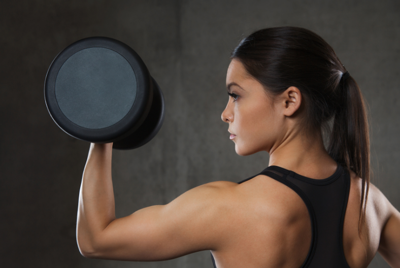 beautiful woman lifting weights